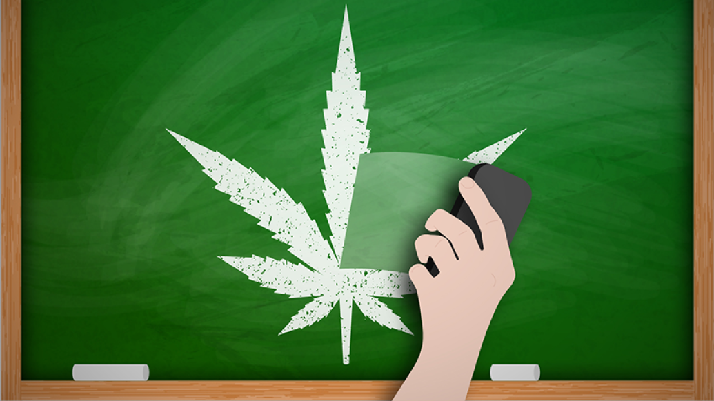 Marijuana leaf drawn on chalk on a blackboard