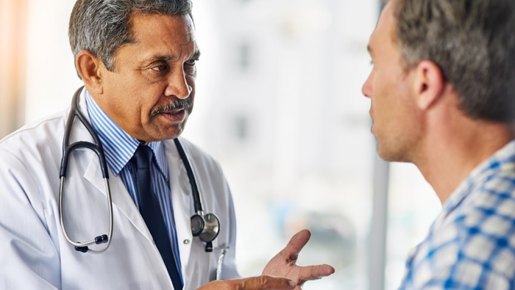 A doctor talking to a patient about prostate cancer